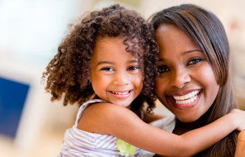 laughing mother with daughter